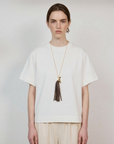 SPIRIT GOLD-PLATED PENDANT WITH BROWN LEATHER-FRINGED TAIL