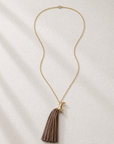 SPIRIT GOLD-PLATED PENDANT WITH BROWN LEATHER-FRINGED TAIL