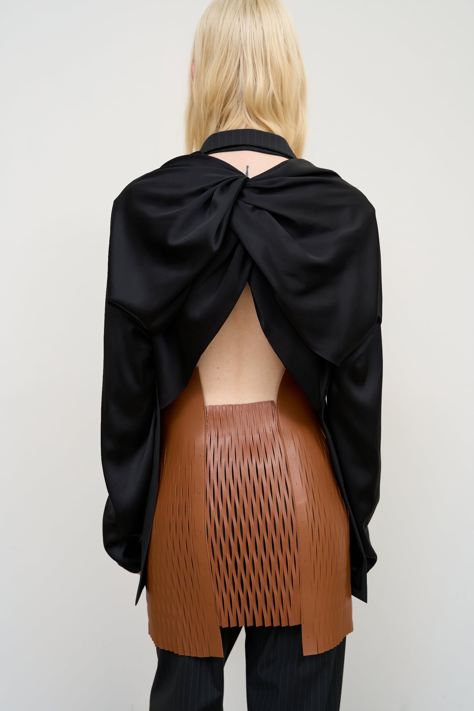 FITTED VEST WITH TWISTABLE SLEEVE DETAIL