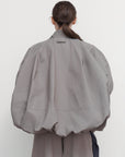 VOLUMINOUS BOMBER WITH DRAWSTRING