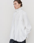 PEPLUM-PLEAT BLOUSE