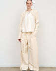 Loose-Fitted Beige Blouse with Structured Jacket Sleeves 1
