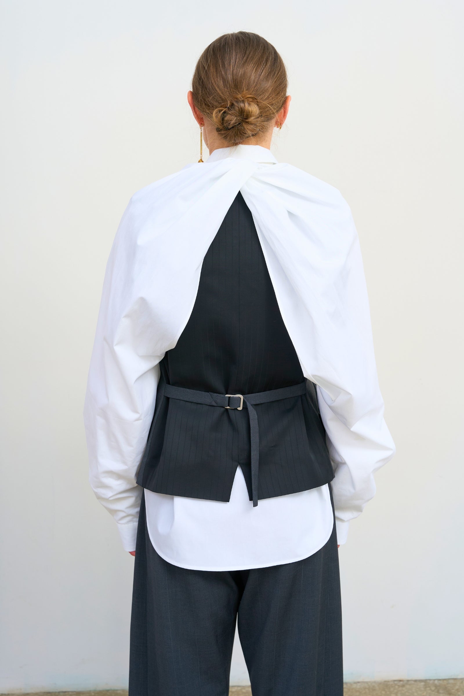 TAILORED VEST WITH FLORAL ACCENTS