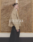 BEIGE CAPE OVERLAY BOMBER JACKET compressed video