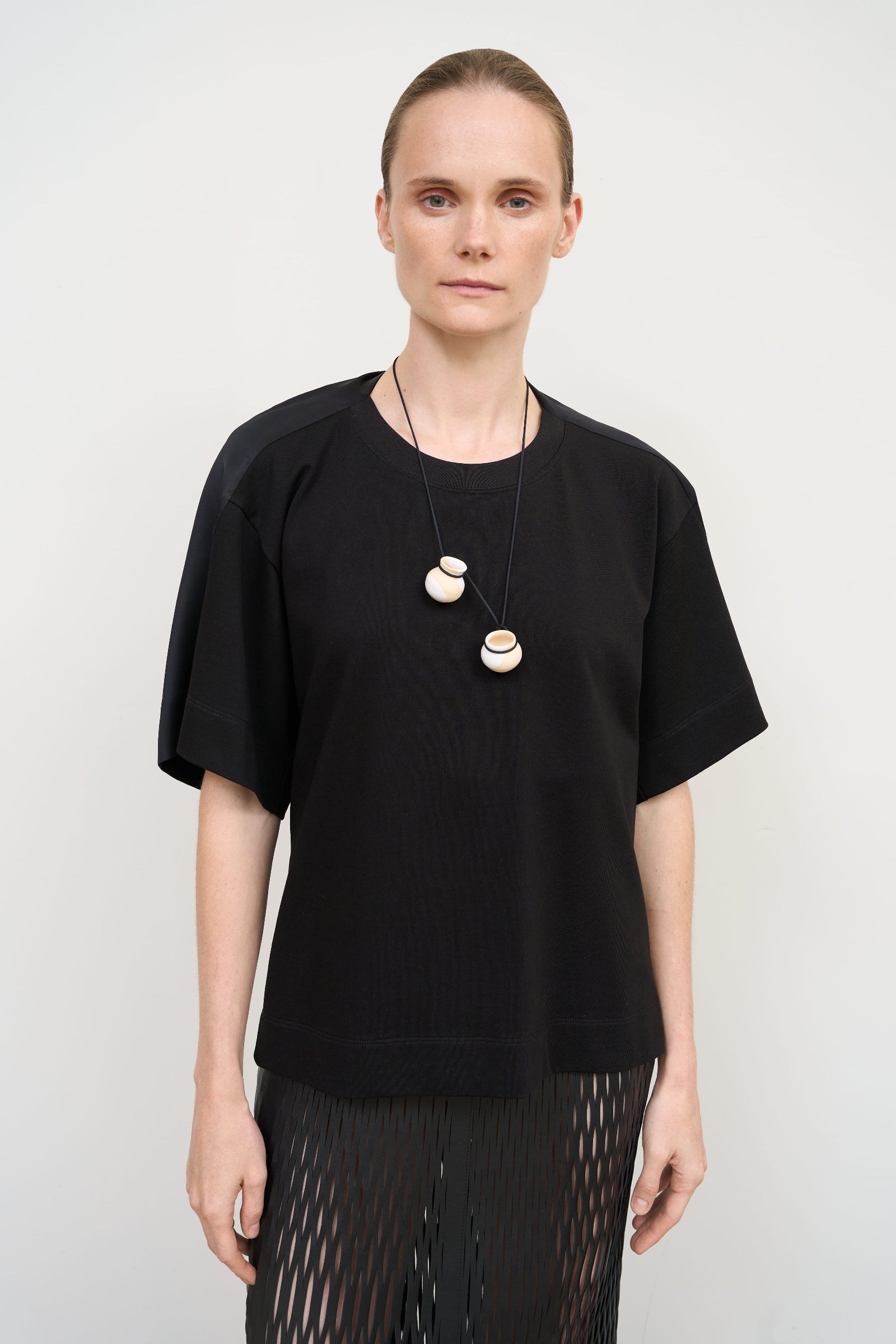 BLACK COTTON T-SHIRT WITH TWISTED NECK