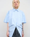 BLUE COTTON SHIRT WITH A TWISTED BACK
