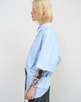 BLUE COTTON SHIRT WITH A TWISTED BACK 1