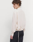 LAYERED BLOUSE WITH TUCKED HEM