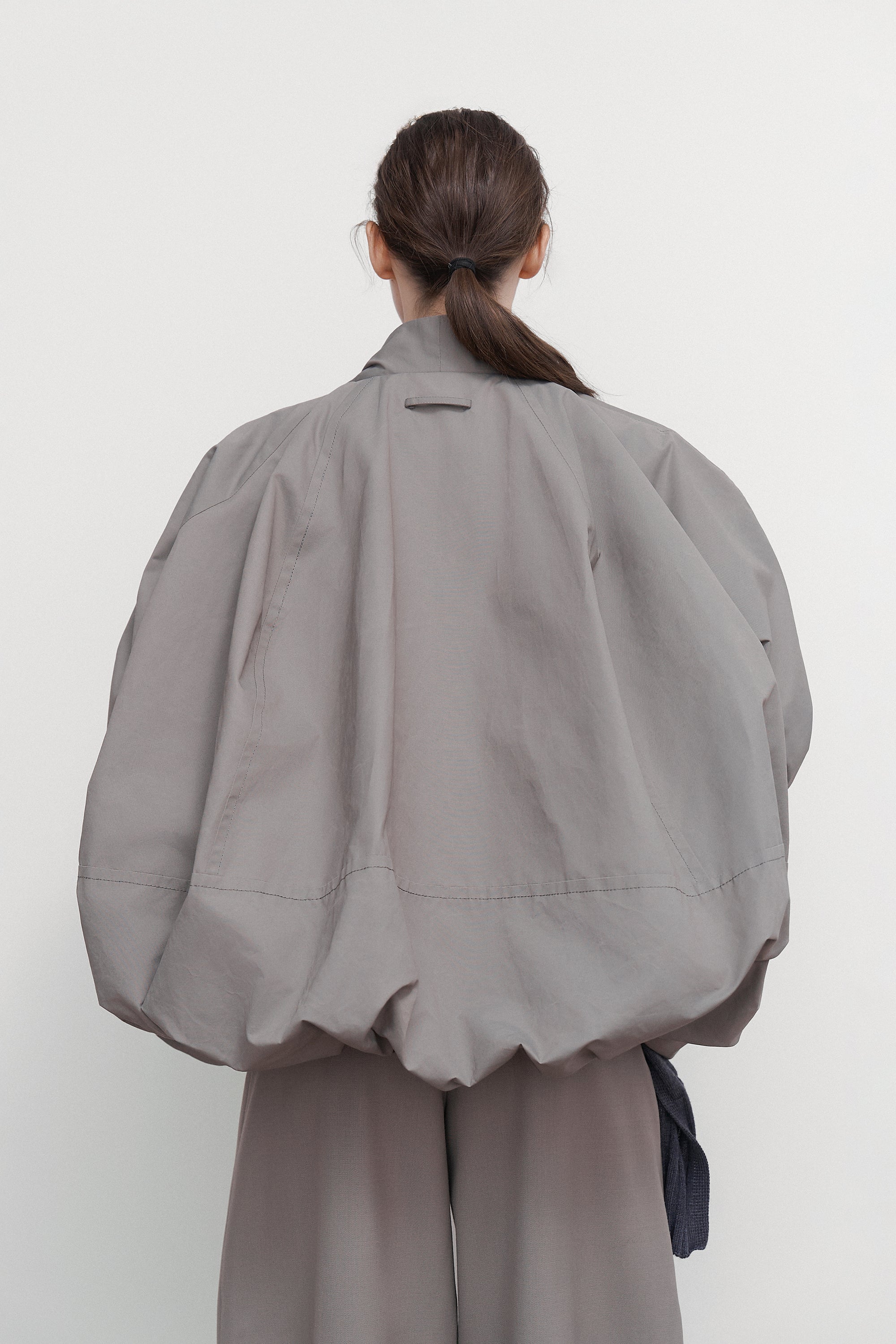 VOLUMINOUS BOMBER WITH DRAWSTRING