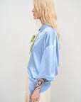 SATIN BLOUSE WITH A TWISTED BACK