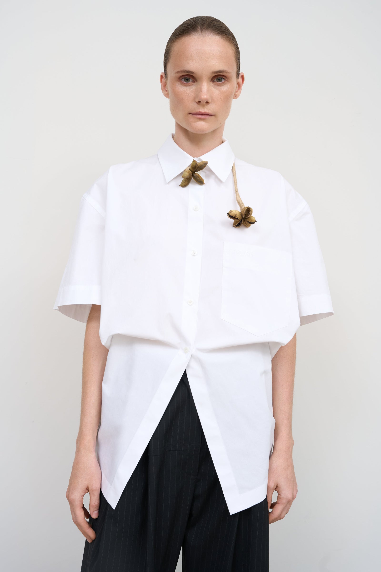 WHITE COTTON SHIRT WITH A TWISTED BACK 1