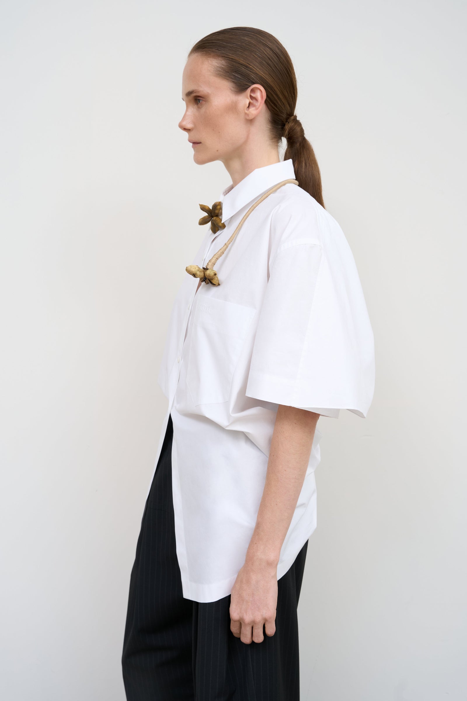 WHITE COTTON SHIRT WITH A TWISTED BACK 2