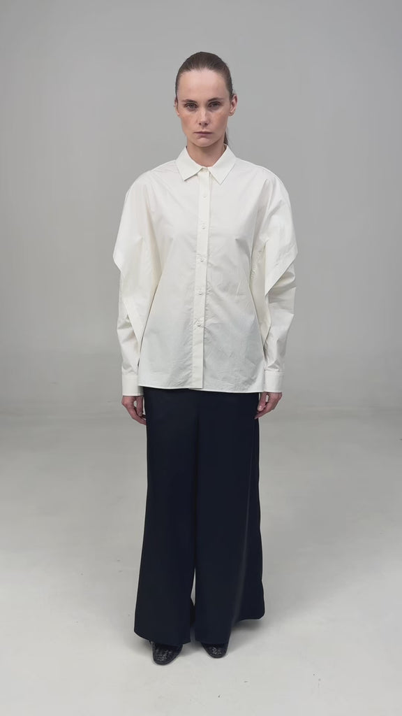 FITTED SHIRT WITH CAPELET OVERLAY AND OPEN BACK